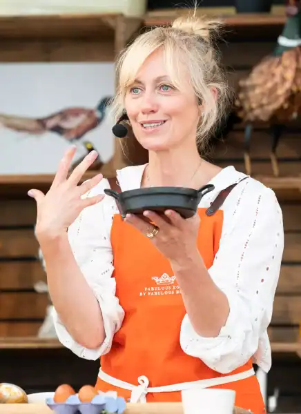 Event management professional speaking at a conference.