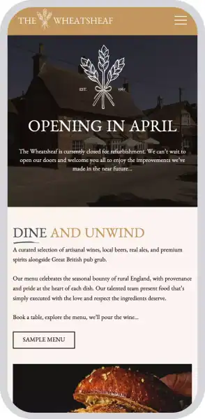 The Wheatsheaf pub exterior with logo, opening soon in April.