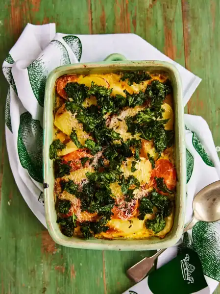 Vegetable lasagna bake with fresh greens and cheese, perfect for social media sharing.