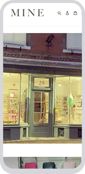 Elegant boutique shopfront with large glass windows and stylish signage.