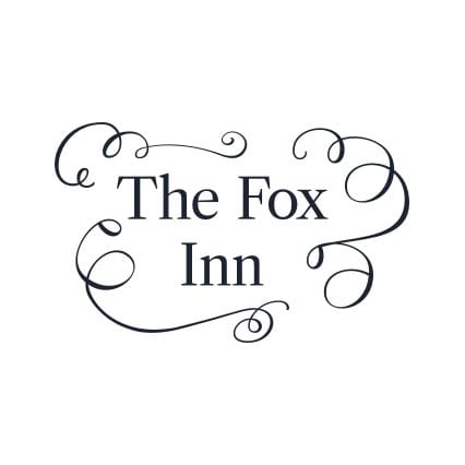 Logo of The Fox Inn with elegant swirling design elements.